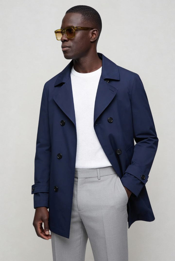 Men’s navy double breasted trench coat front view posing