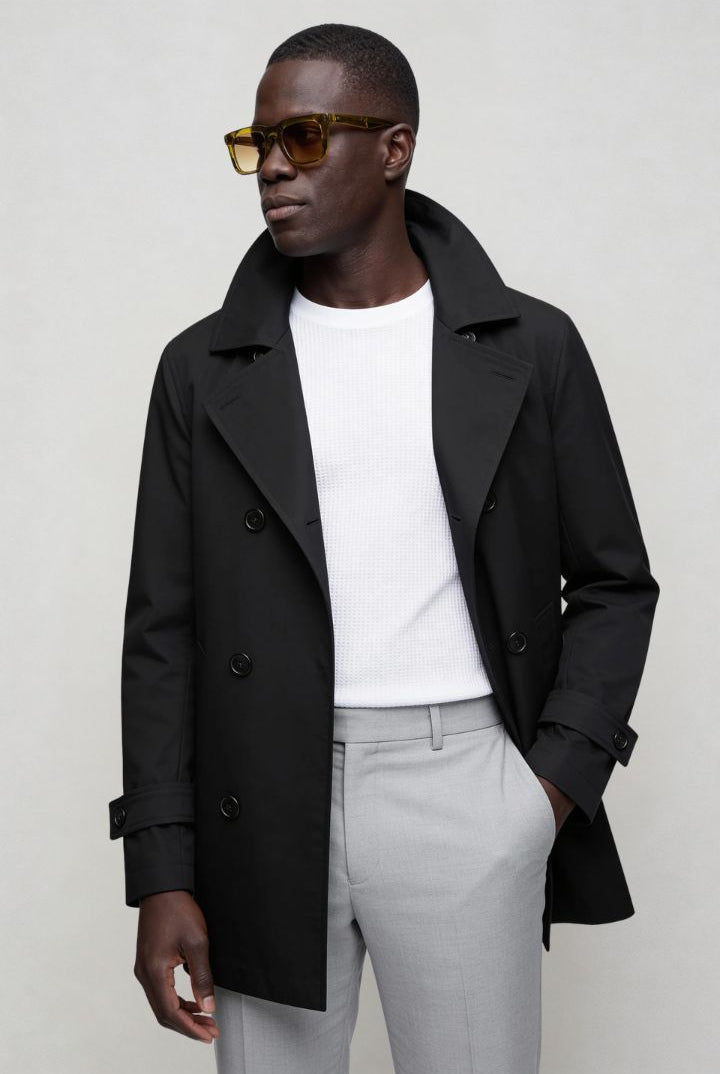 Men’s black double breasted trench coat front view posing