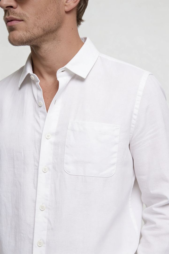 Men’s white linen resort set with relaxed linen shirt and drawstring pants lightweight summer outfit close-up