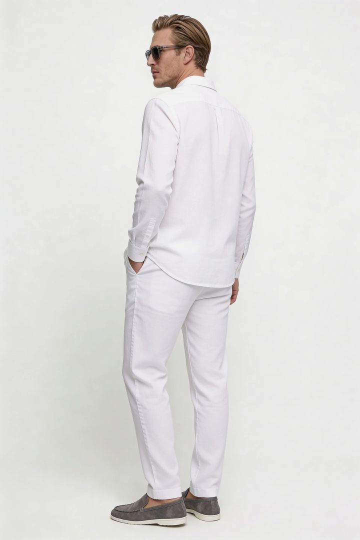 Men’s white linen resort set with relaxed linen shirt and drawstring pants lightweight summer outfit back view