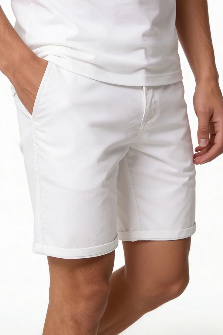 Men’s white cotton chino shorts with tailored fit designed for breathable summer comfort close-up