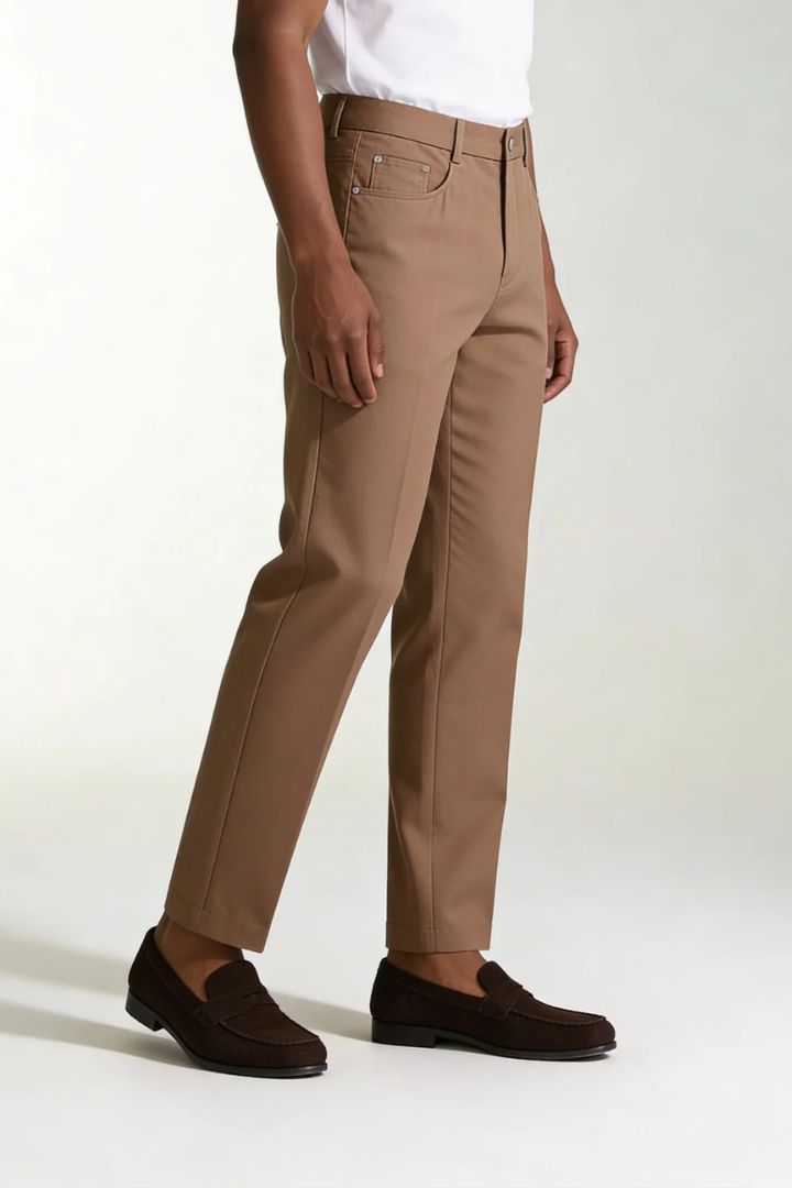 Men’s lightweight lyocell linen tailored trousers in warm brown tone pose