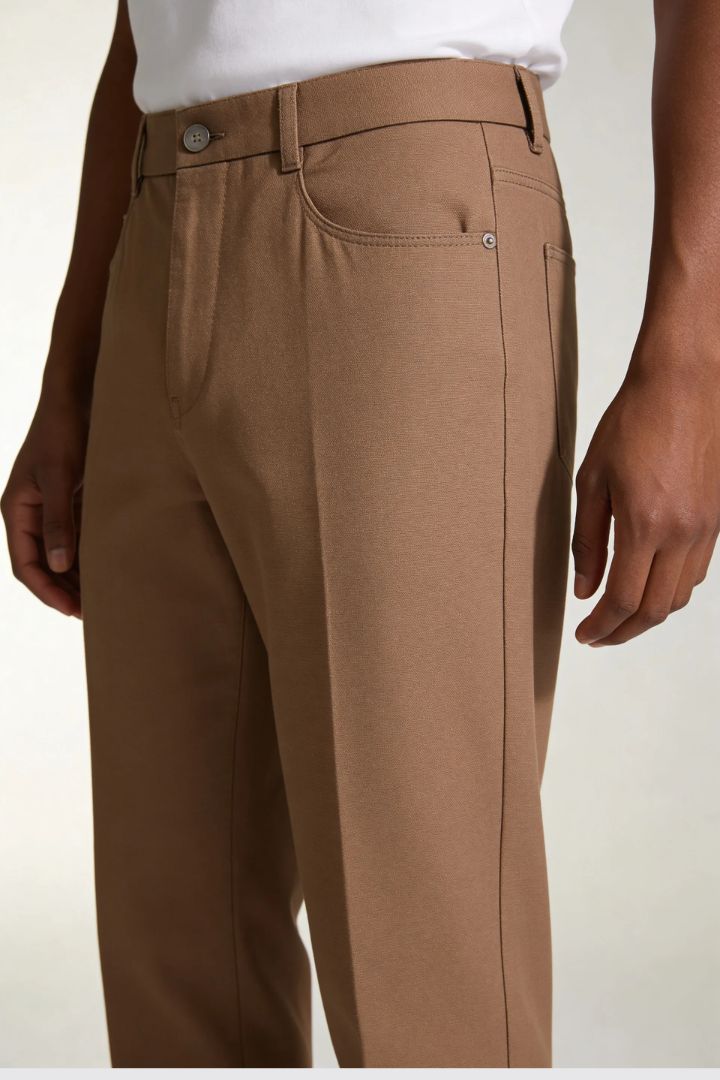 Men’s lightweight lyocell linen tailored trousers in warm brown tone close-up