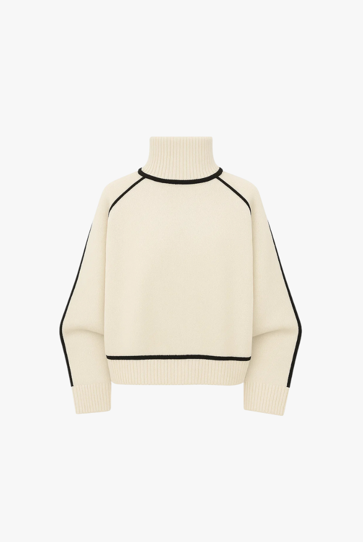 Cream-colored sweater with black accents on a white background