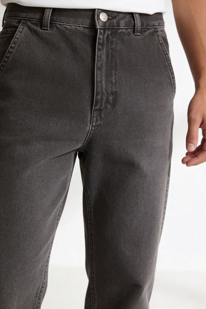 Men’s straight leg 100% cotton jeans in washed gray denim close up