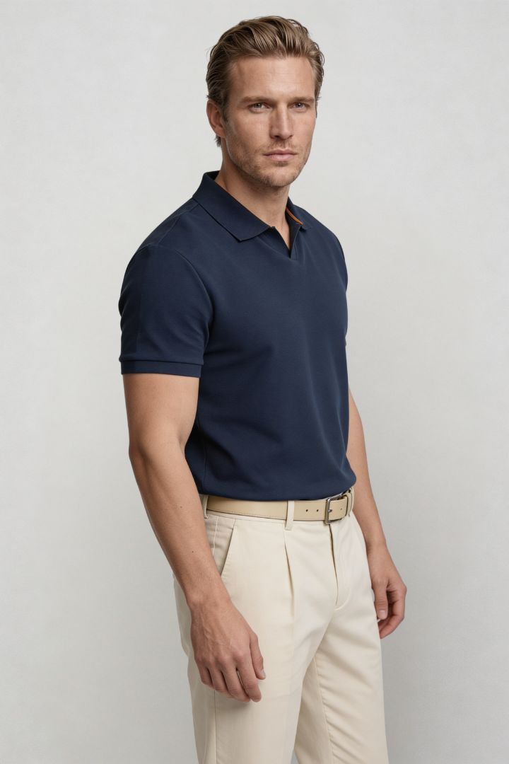 Men’s navy cotton polo shirt with tailored fit and structured collar side profile
