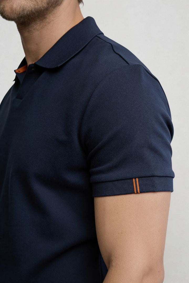 Men’s navy cotton polo shirt with tailored fit and structured collar close up