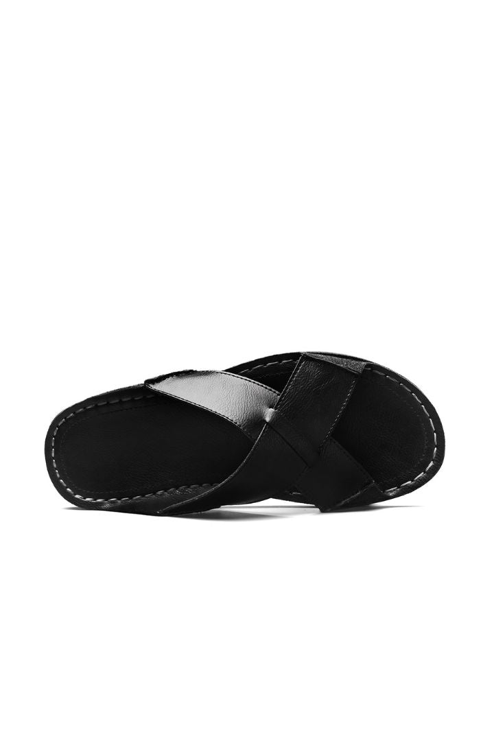Men’s black cross-strap leather slide sandals with cowhide upper and stitched footbed design upper view
