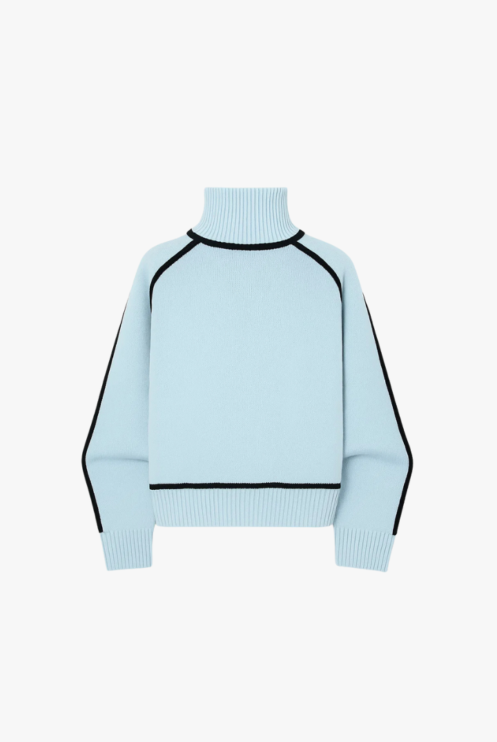 Light blue sweater with black accents on a white background