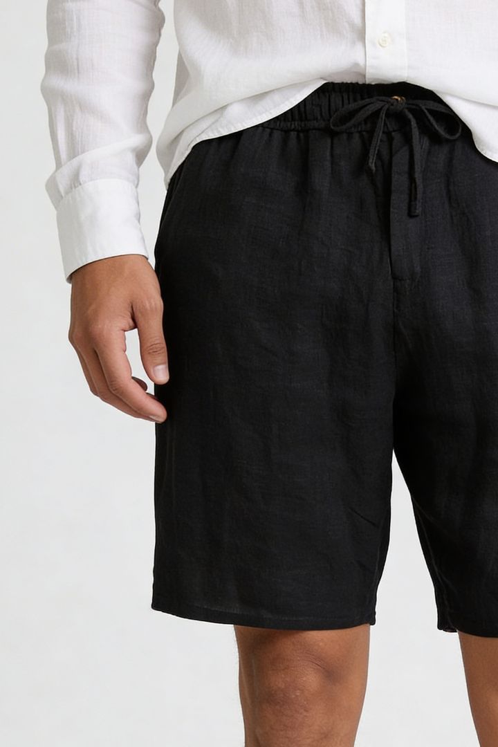 Men’s 100% linen black drawstring shorts with elastic waist and relaxed summer fit close-up