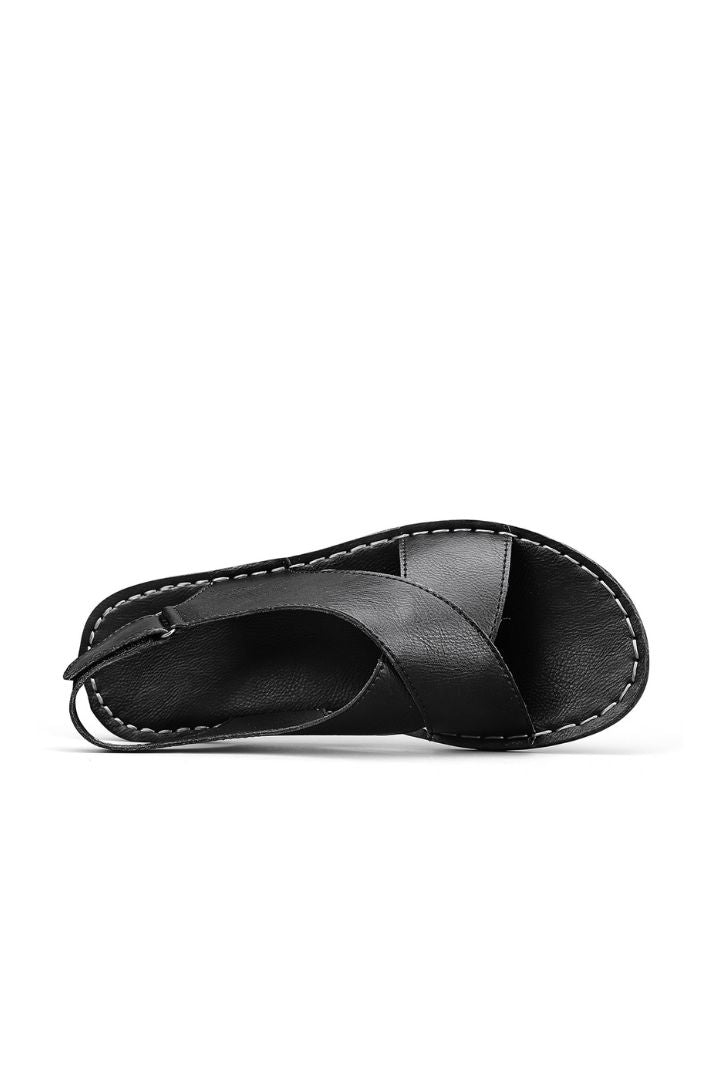 Men’s black leather cross-strap sandals with adjustable heel strap and stitched sole detail top view