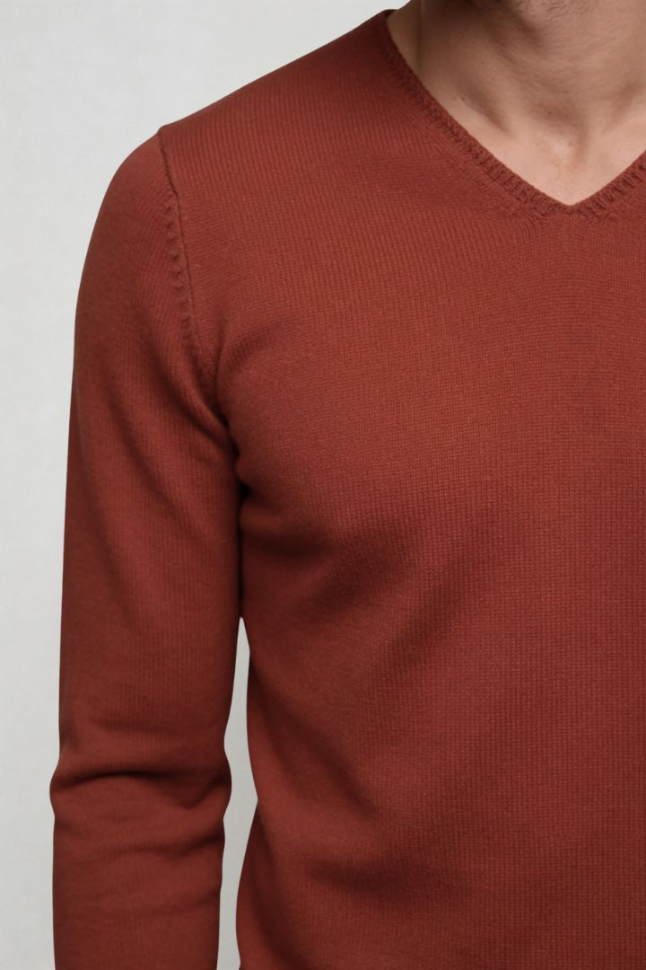 Men’s red lightweight V-neck knit sweater with ribbed cuffs and clean slim silhouette close-up