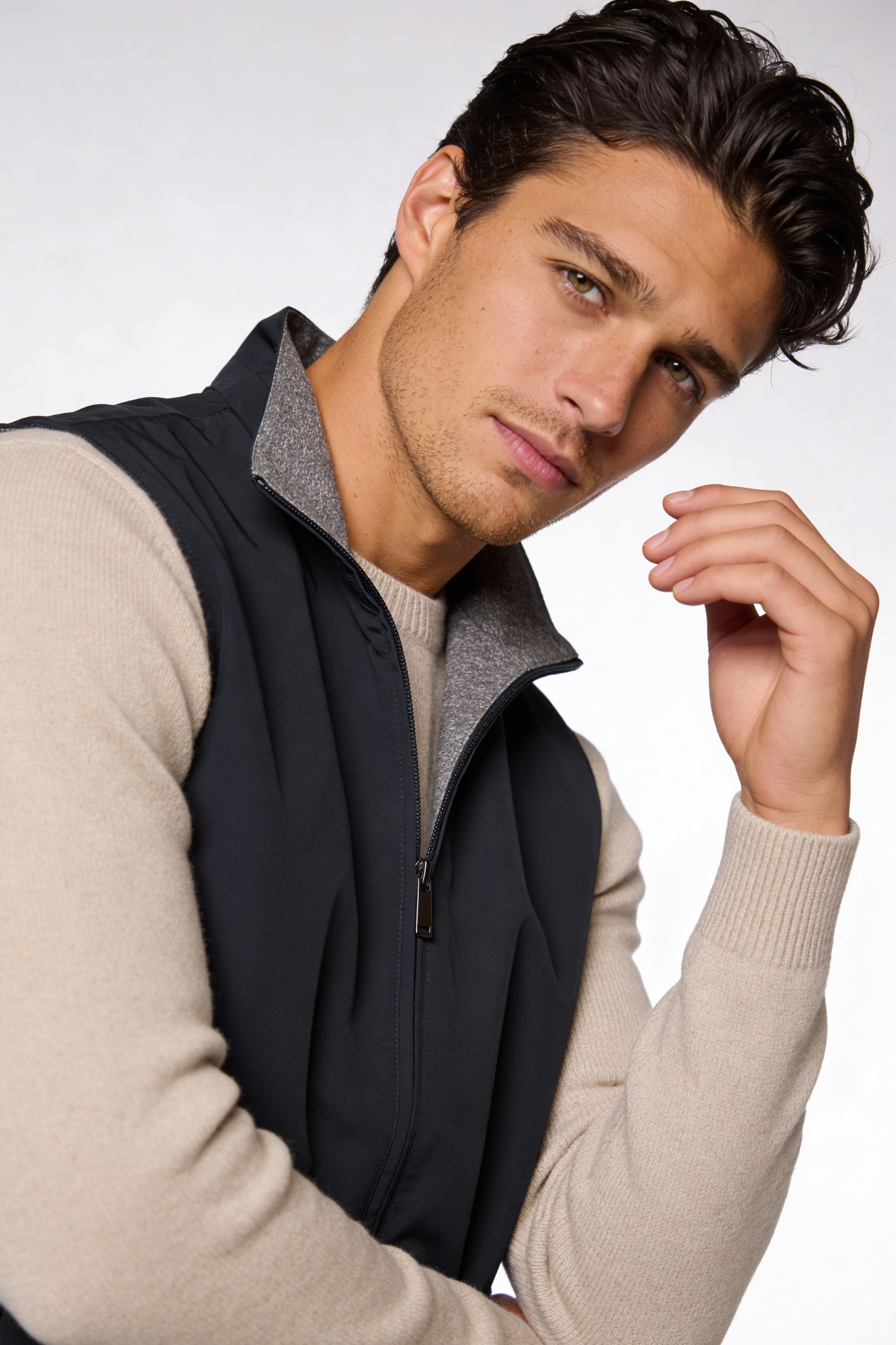 Men wearing a premium reversible lightweight vest with a clean, tailored fit, designed for versatile everyday layering.