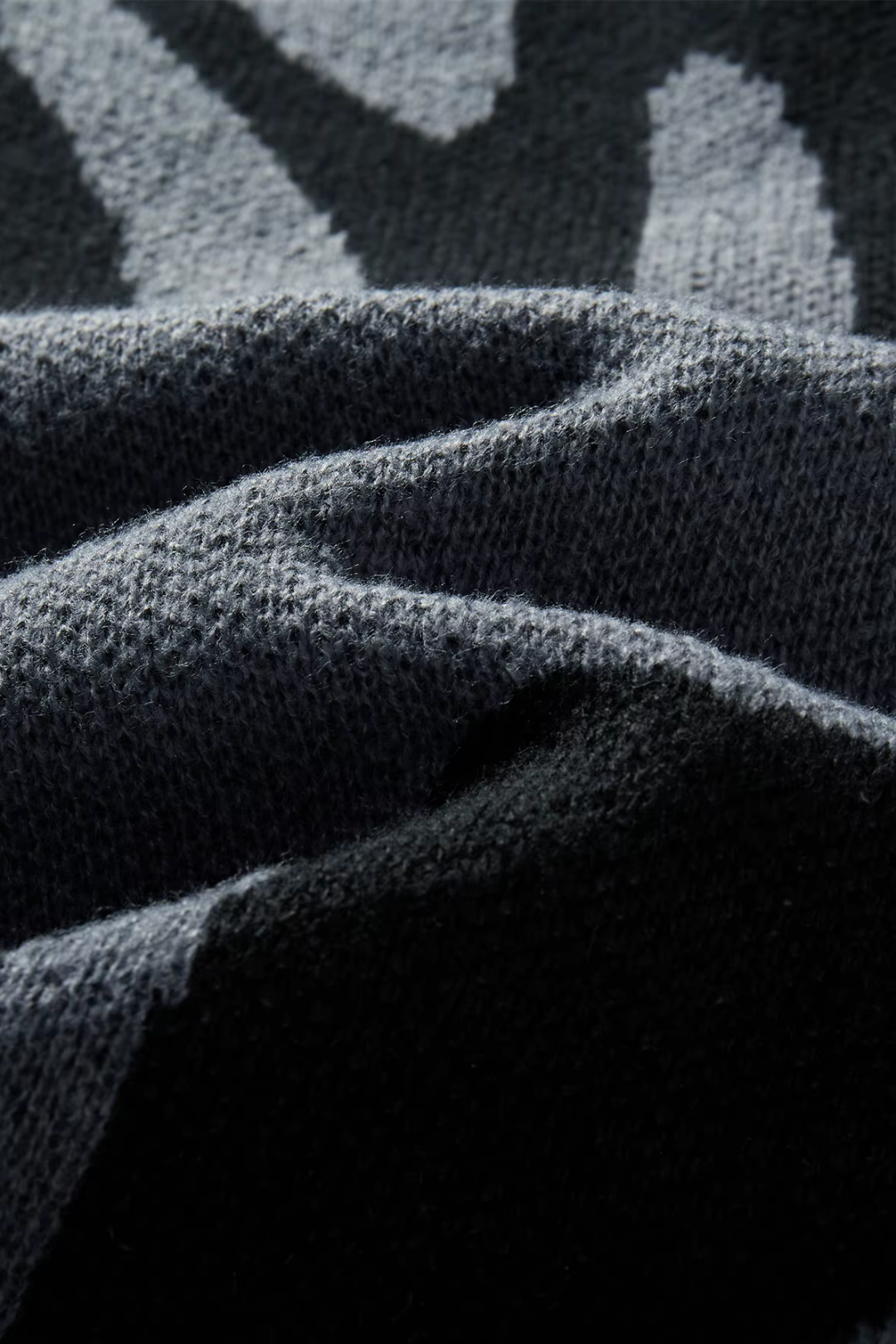 Close-up of textured fabric with a patterned background