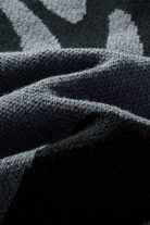 Close-up of textured fabric with a patterned background