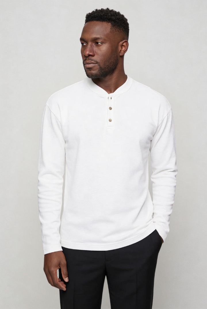 Men’s slim fit long sleeve henley shirt in cotton waffle knit texture pose