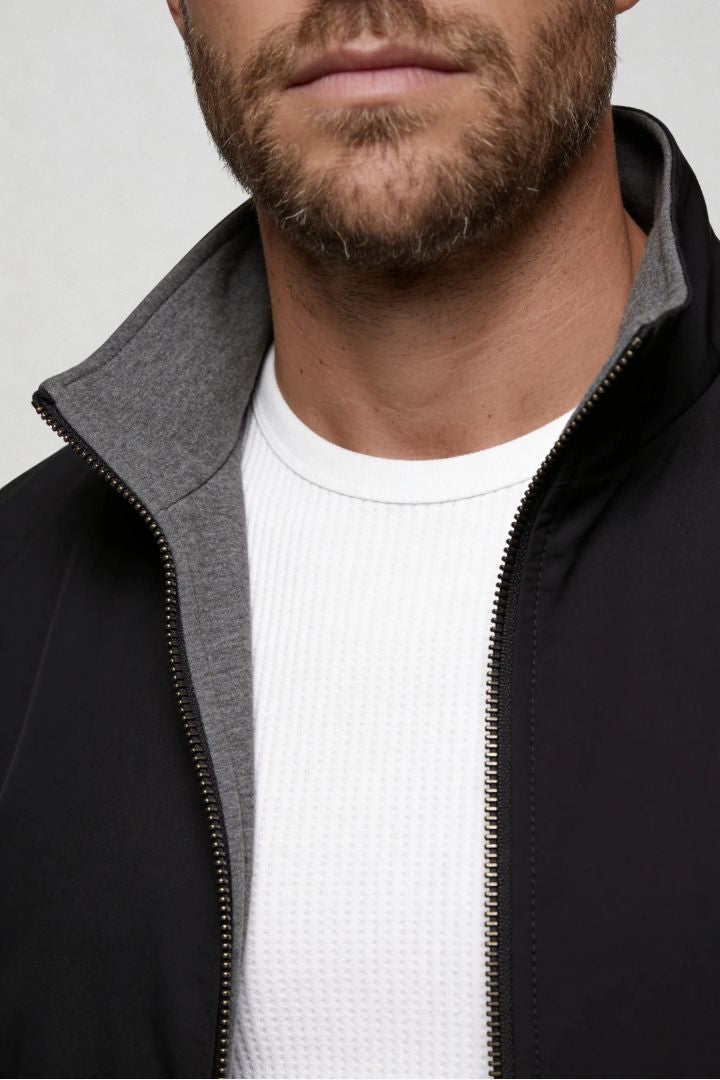 Men’s lightweight reversible zip up jacket with slim fit modern casual design close up