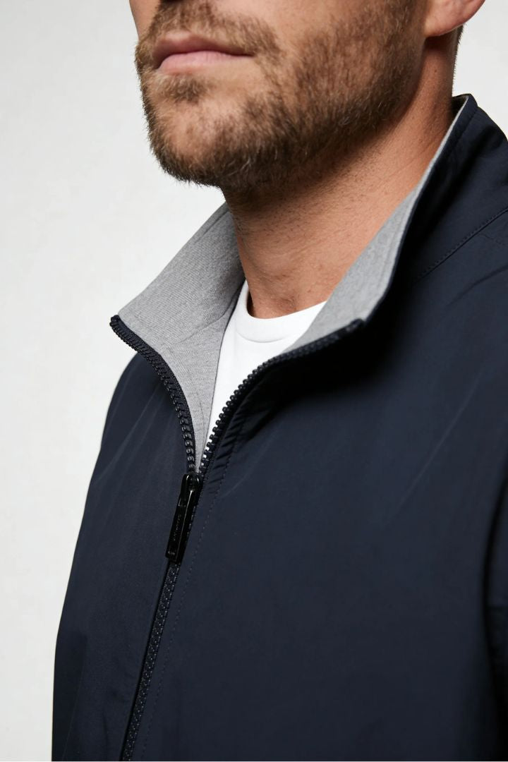 Men’s lightweight reversible zip up jacket with slim fit modern casual design close up