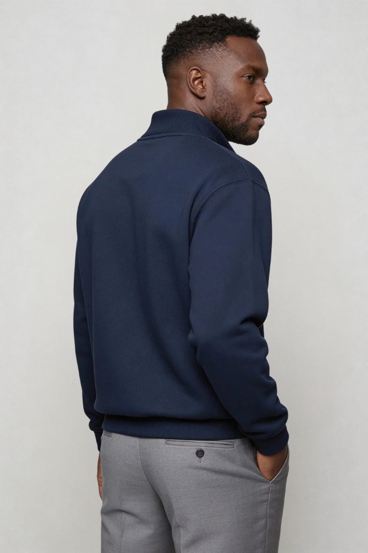 Men’s navy quarter zip cotton sweater with tailored slim fit and metal zipper detail side pose