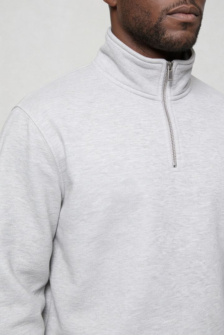 Men’s navy quarter zip cotton sweater with tailored slim fit and metal zipper detail close up