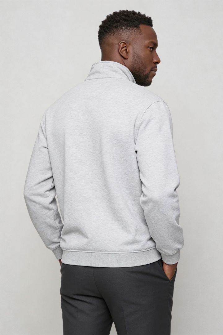 Men’s navy quarter zip cotton sweater with tailored slim fit and metal zipper detail back