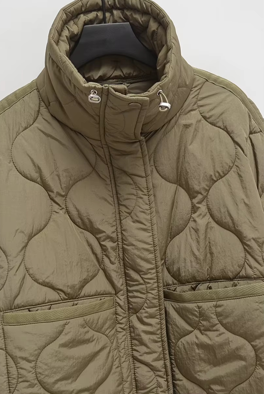 Textured wave quilt stitching on olive women’s puffer coat