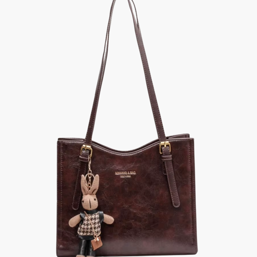 Women’s brown vegan-leather shoulder bag—medium tote with long straps, front view.