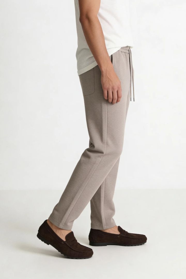 Men’s wool blend drawstring trousers in sand taupe – side view