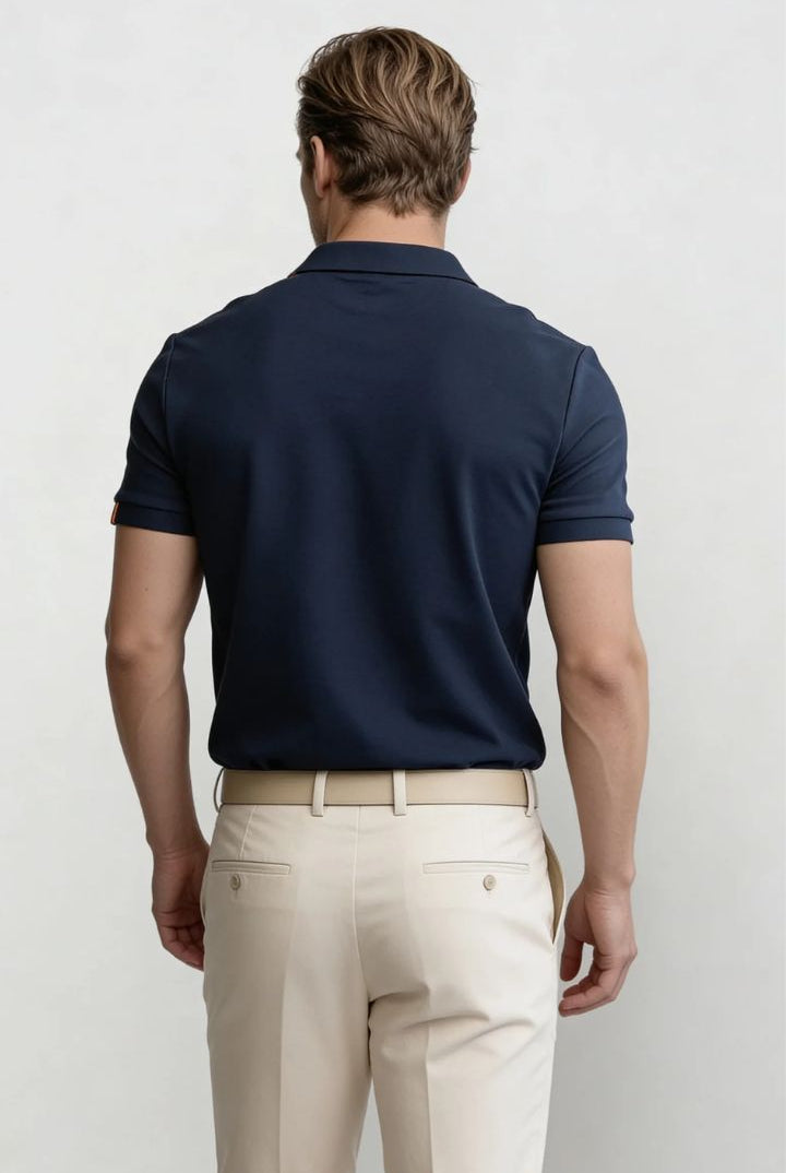 Men’s navy cotton polo shirt with tailored fit and structured collar back pose