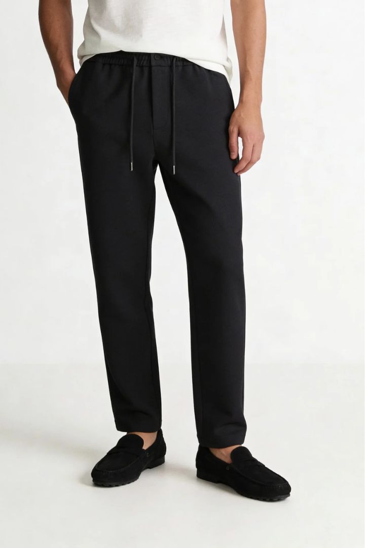 Men’s wool blend drawstring trousers in jet black – front view