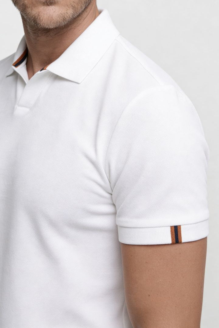 Men’s white cotton polo shirt with tailored fit and structured collar close up