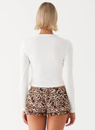 Back view—women’s black rib knit long-sleeve top