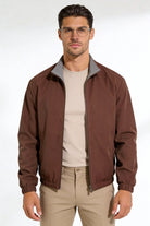 Men wearing a premium reversible brown lightweight jacket with a clean, tailored fit, designed for versatile everyday layering.