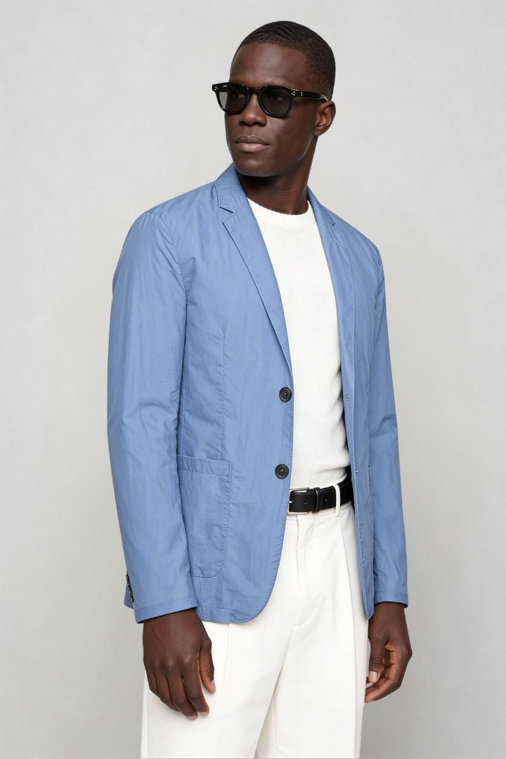 Man wearing lightweight light blue blazer jacket side view