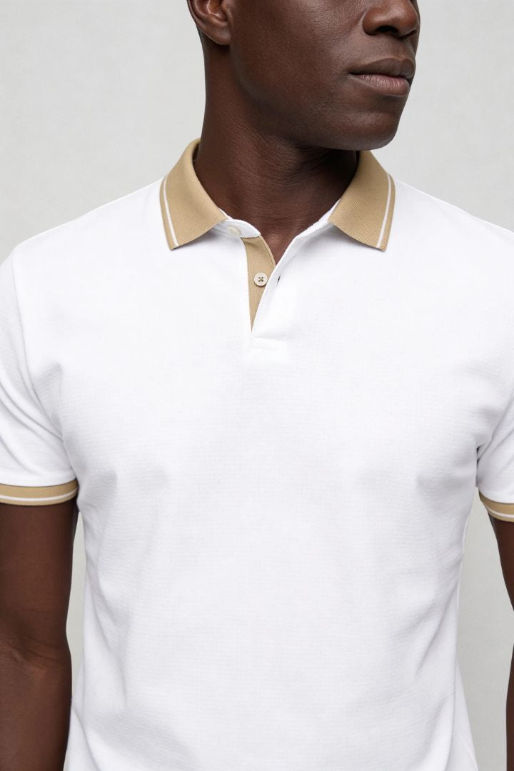 Men’s tailored summer polo shirt with contrast collar and breathable stretch fabric for modern casual style in white close-up