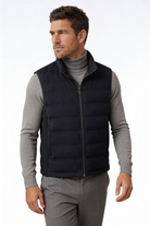 Man wearing the black insulated puffer vest of Lavencio