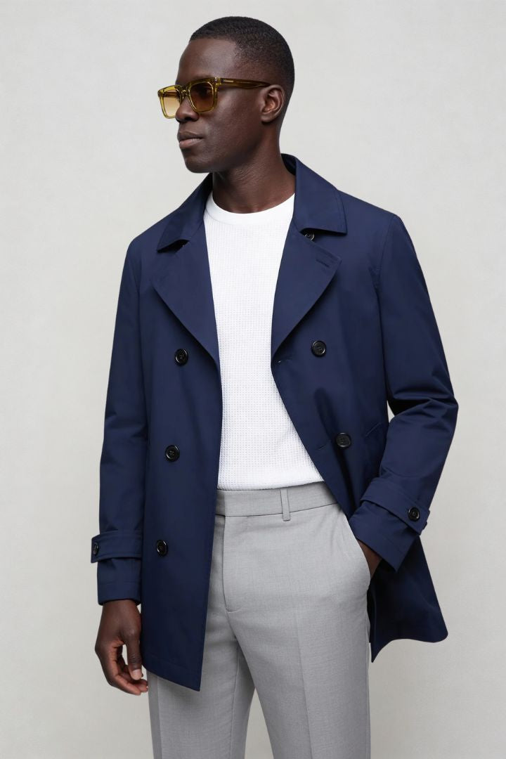 Men’s navy double breasted trench coat front view posing