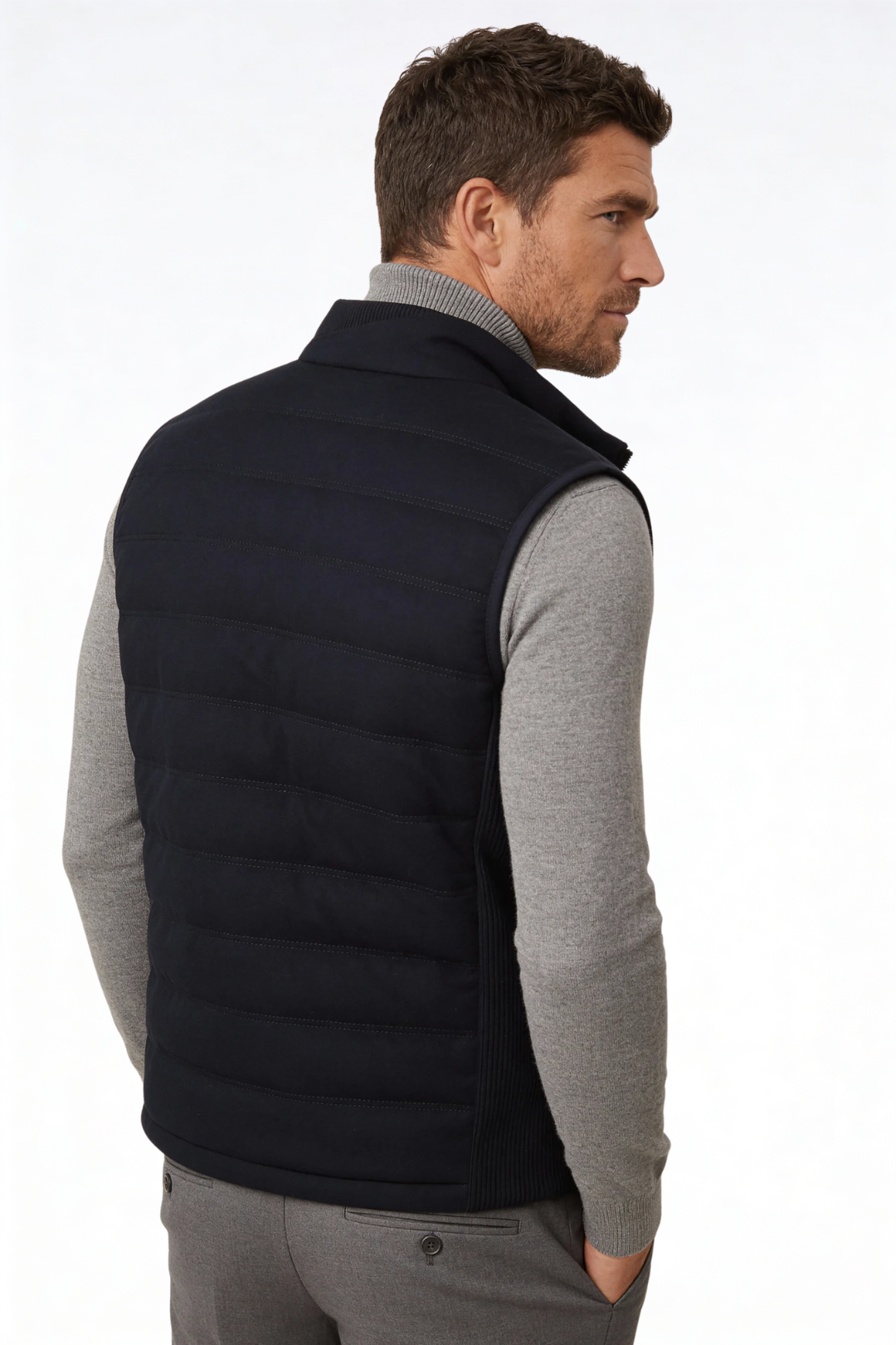 Man wearing the black insulated puffer vest of Lavencio