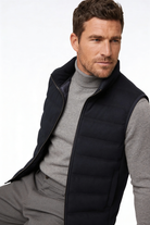 Man wearing the black insulated puffer vest of Lavencio