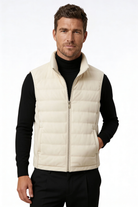 Man wearing the white insulated puffer vest of Lavencio