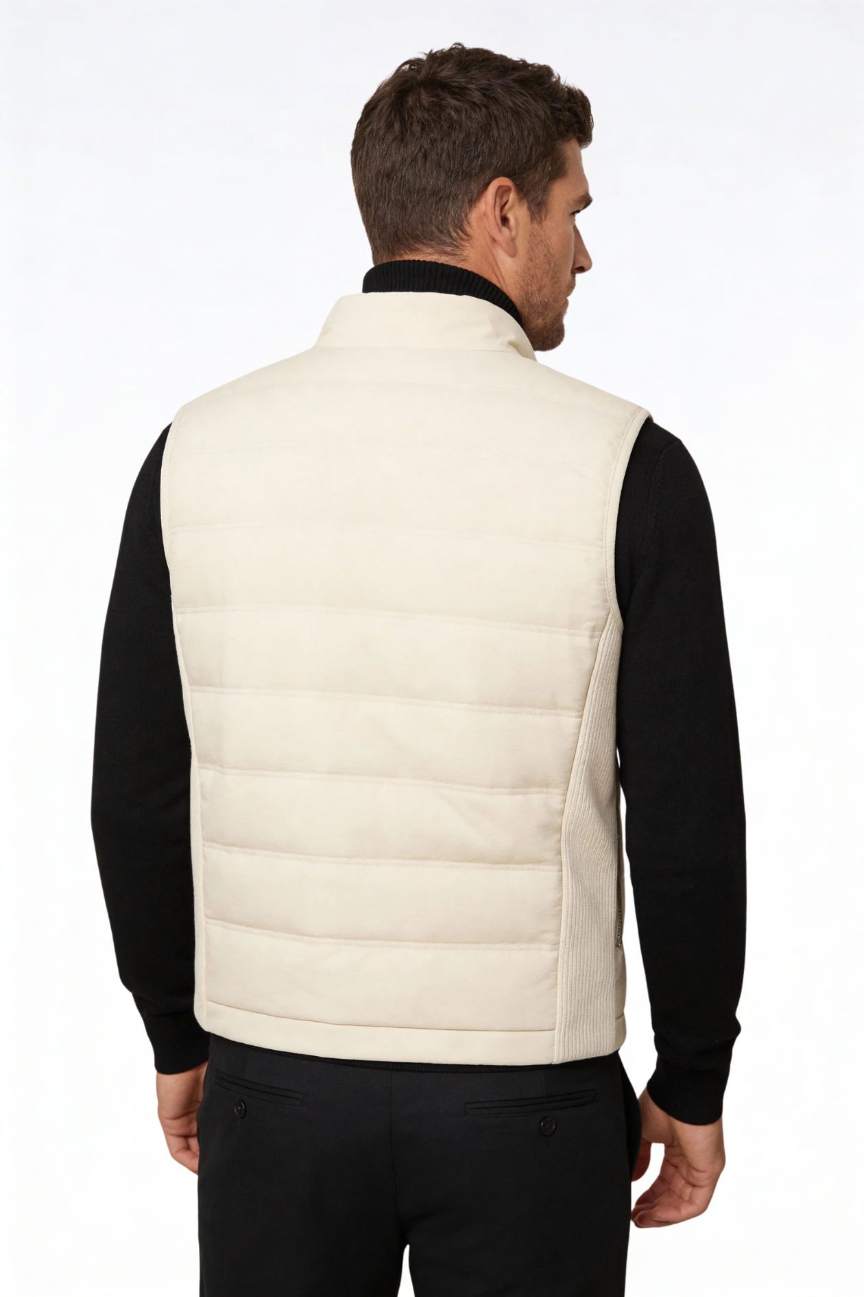 Man wearing the white insulated puffer vest of Lavencio