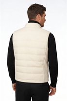 Man wearing the white insulated puffer vest of Lavencio