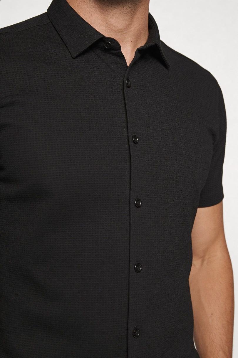 Men’s short sleeve no iron dress shirt with breathable stretch fabric in black close-up