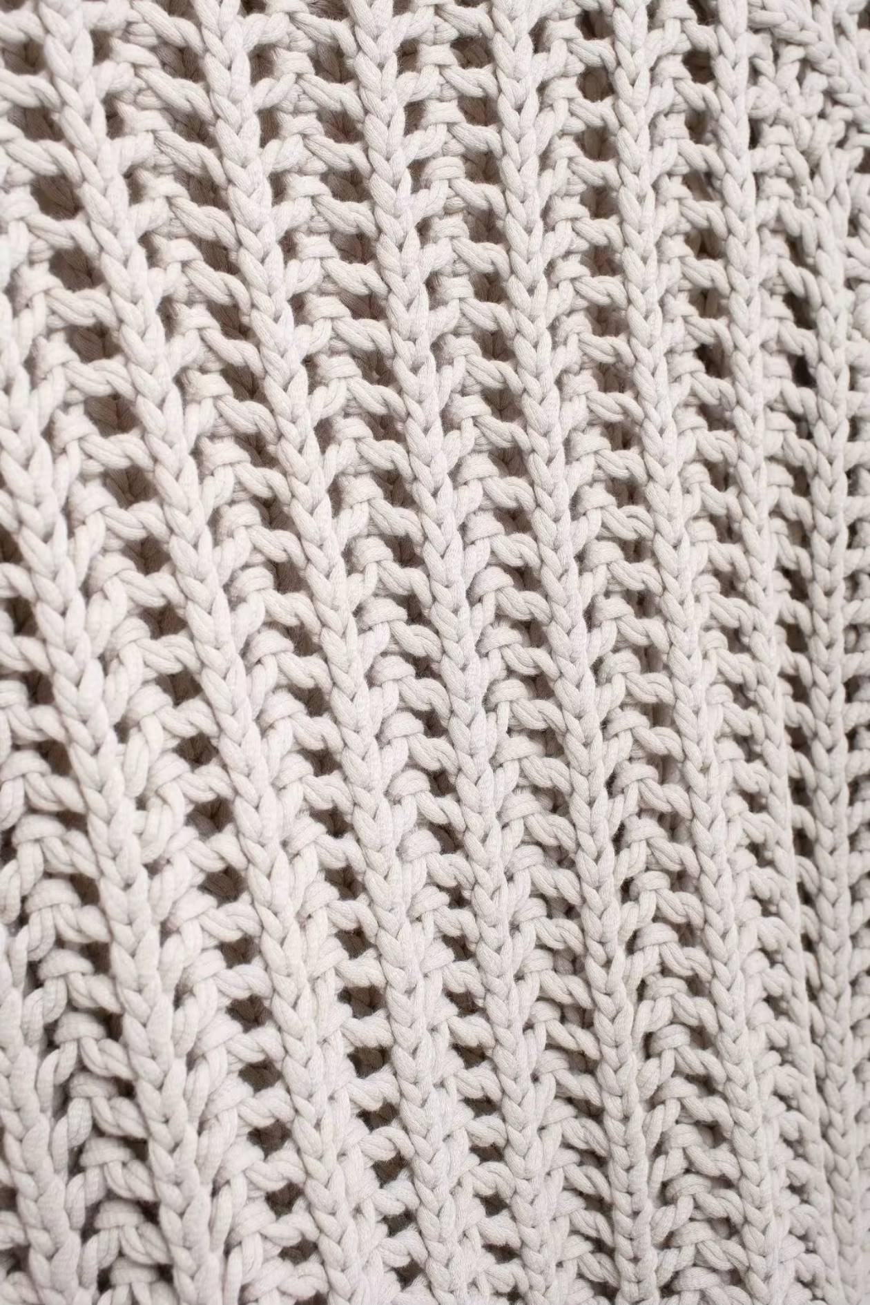Close-up of a beige crochet vest