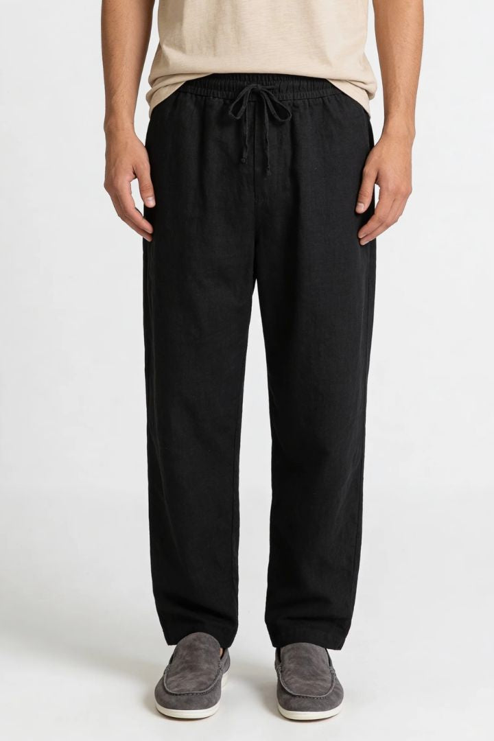 Men wearing black linen drawstring trousers relaxed straight fit lightweight summer linen pants front view