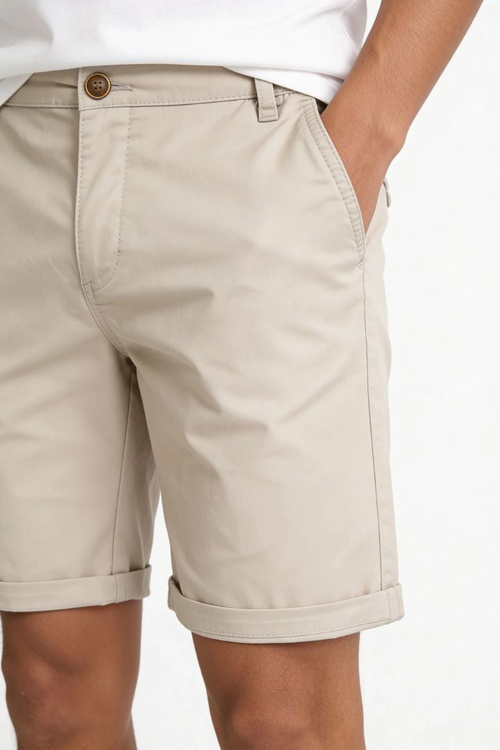 Men’s khaki cotton chino shorts with tailored fit designed for breathable summer comfort close-up