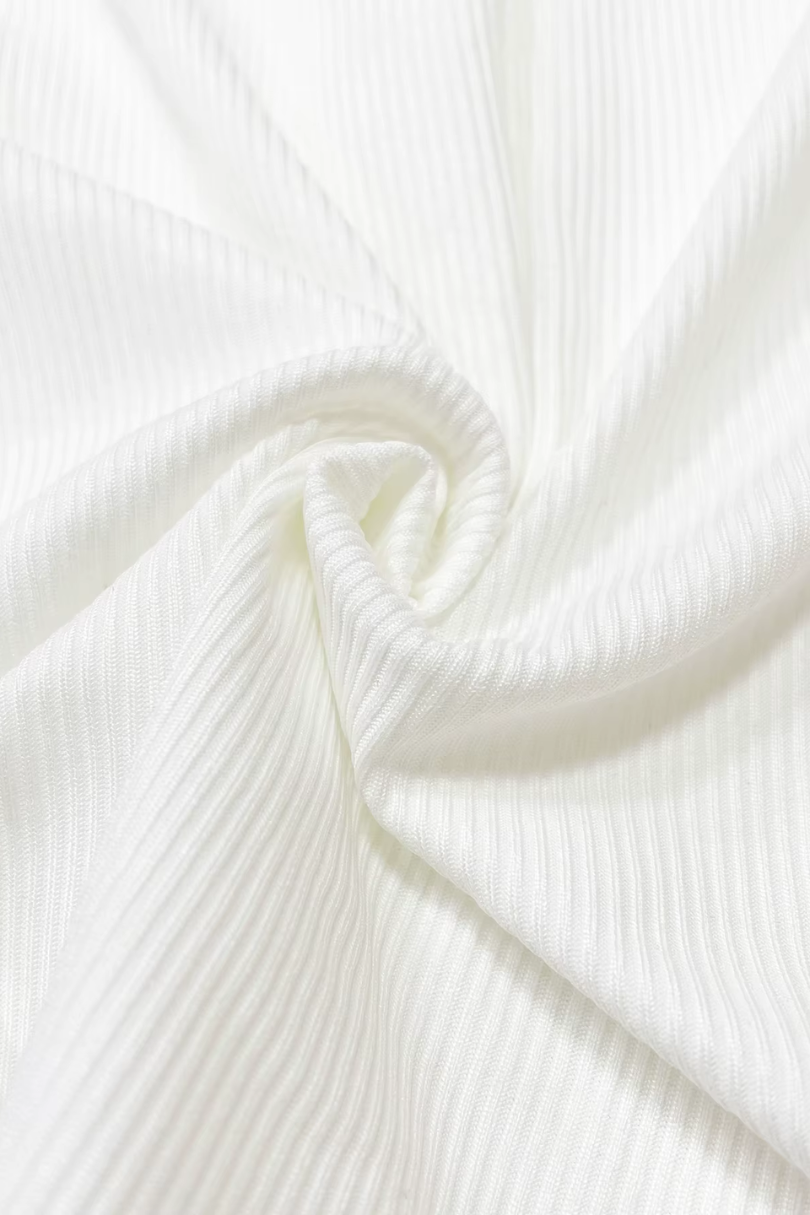 Close-up of white fabric with a subtle texture