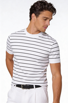 Man wearing the Blake Striped Lyocell T-Shirt with a clean striped design and lightweight fabric in a studio setting.