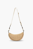 Woven handbag with a strap on a white background