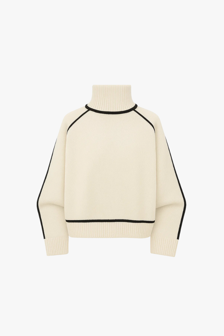 Cream-colored sweater with black accents on a white background